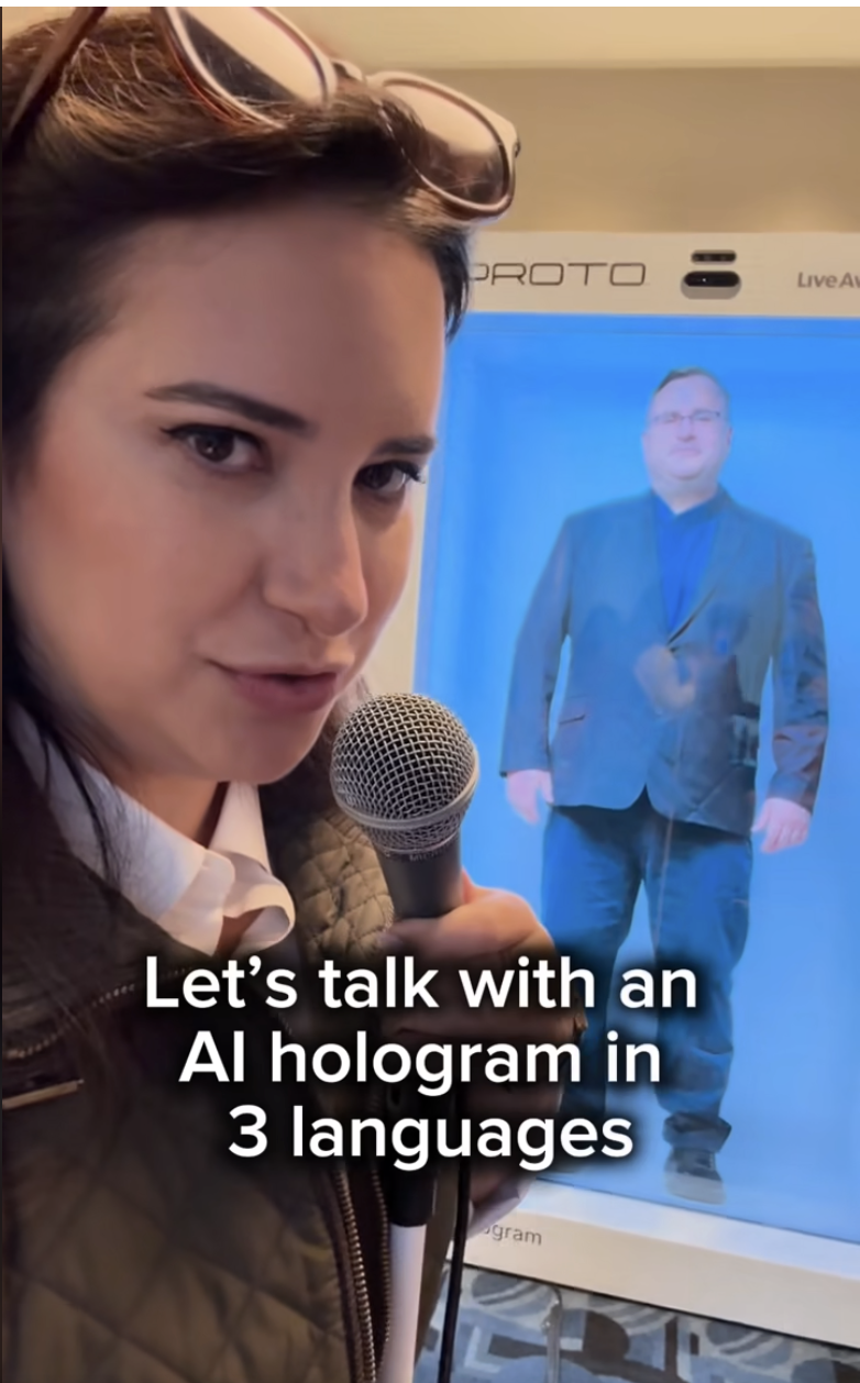 Allie Miller speaking into a microphone in front of the Reid Hoffman AI hologram at Masters of Scale 2025.